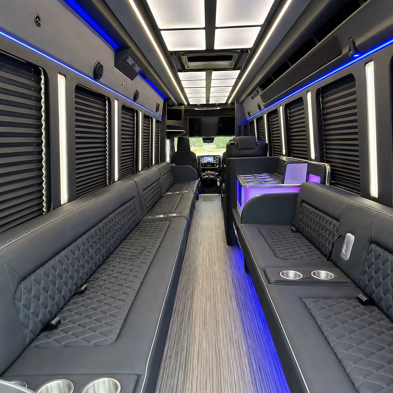 Wedding guests seated inside a party bus serving Greenville
